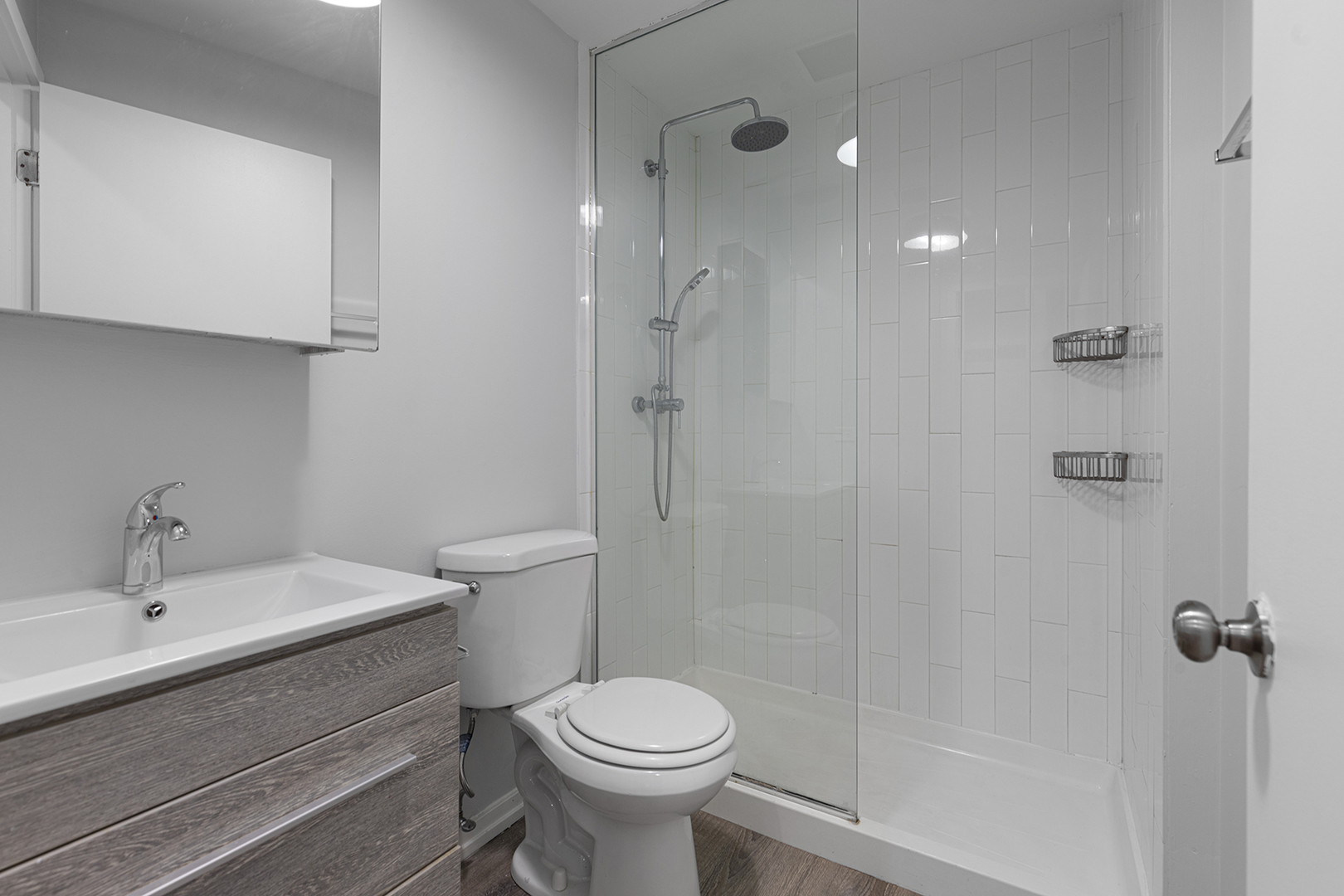 4875 North Magnolia Avenue, Unit 320 Chicago, IL 60640 - Photo 8 of 11 a bathroom with a sink toilet and shower