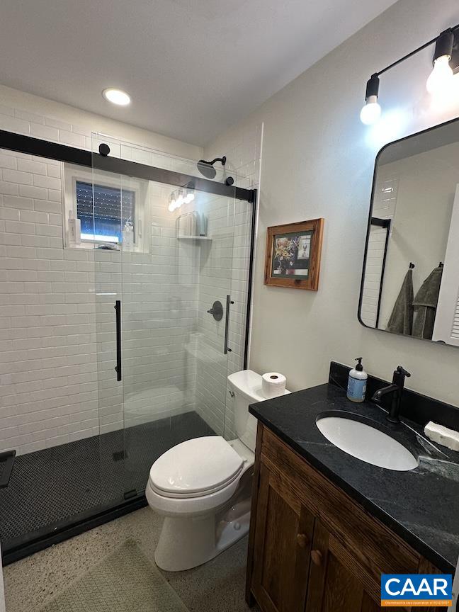 Tbd Tbd Rolling Road Scottsville, VA 24590 - Photo 18 of 19 a bathroom with a granite countertop sink toilet a mirror a vanity and shower