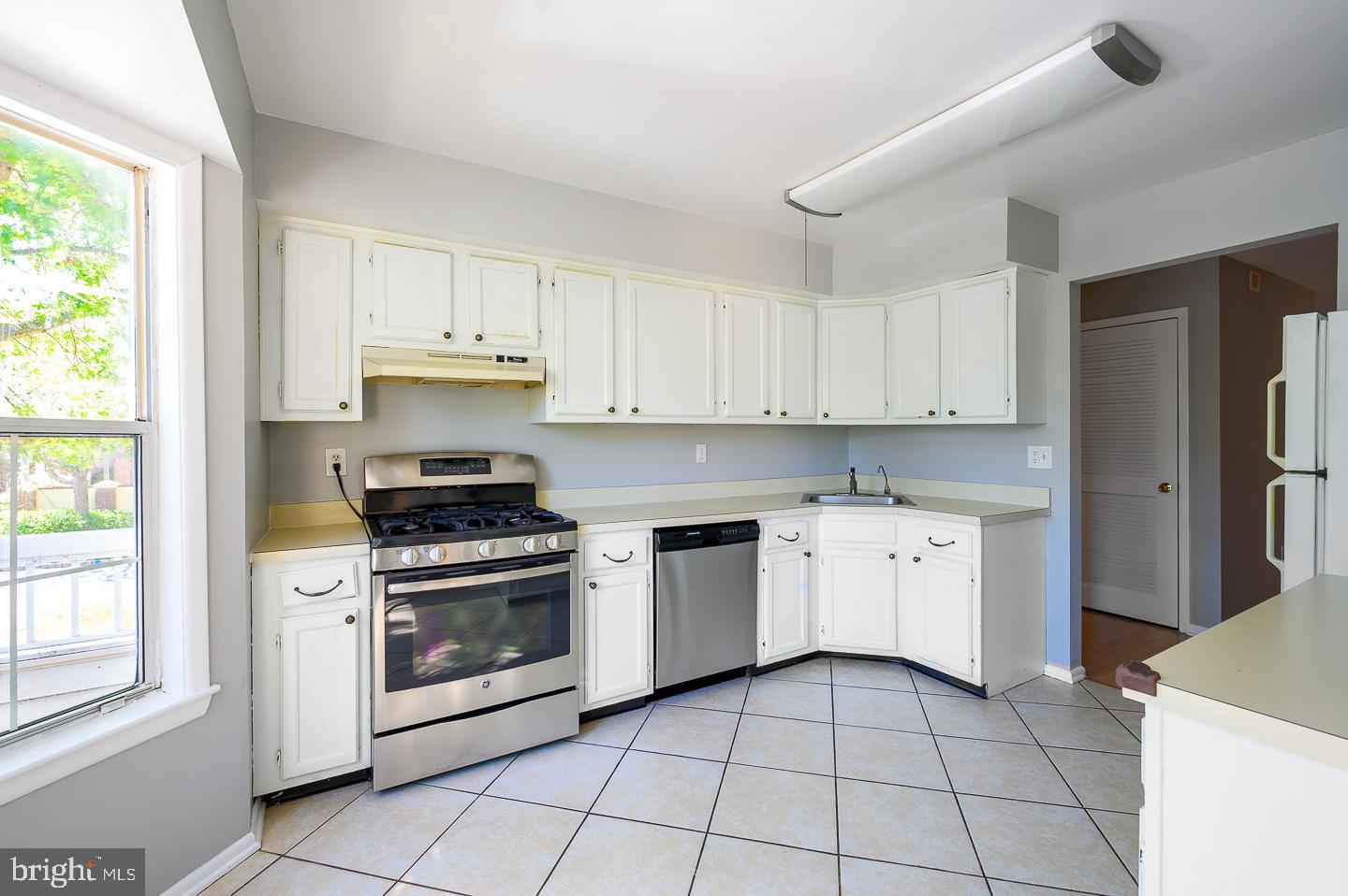 115 Cascade Court, Unit 7 Princeton, NJ 08540 - Photo 16 of 27 a kitchen with a stove top oven sink and cabinets