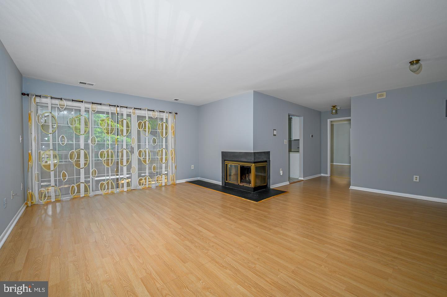 115 Cascade Court, Unit 7 Princeton, NJ 08540 - Photo 4 of 27 a view of empty room with wooden floor and fireplace