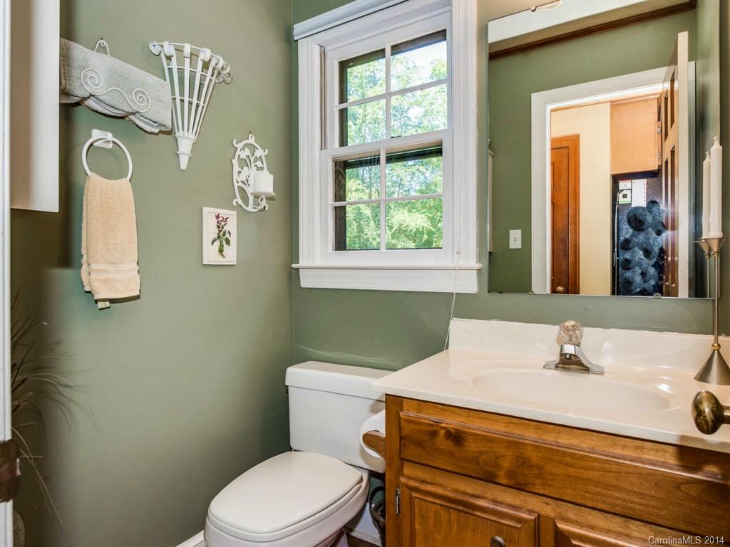 7301 Alexander Road Charlotte, NC 28270 - Photo 14 of 24 a bathroom with a sink a toilet and mirror