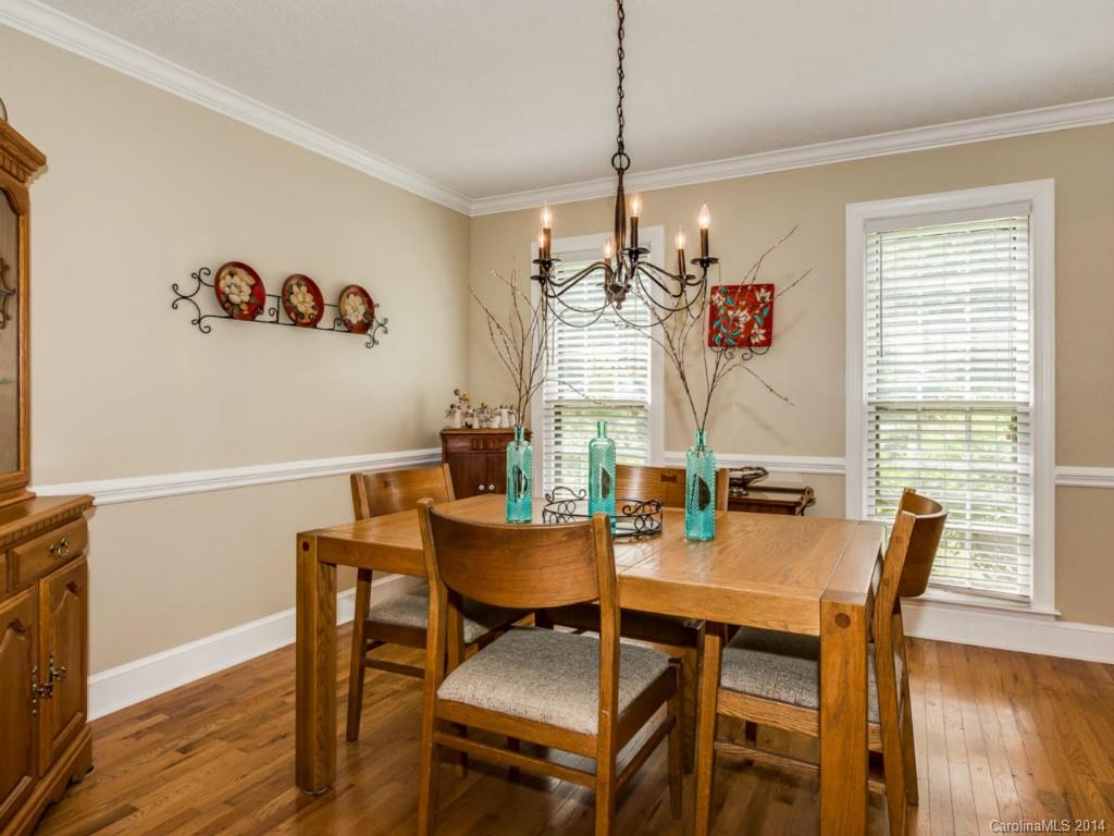 7301 Alexander Road Charlotte, NC 28270 - Photo 5 of 24 a view of a dining room with furniture window and wooden floor