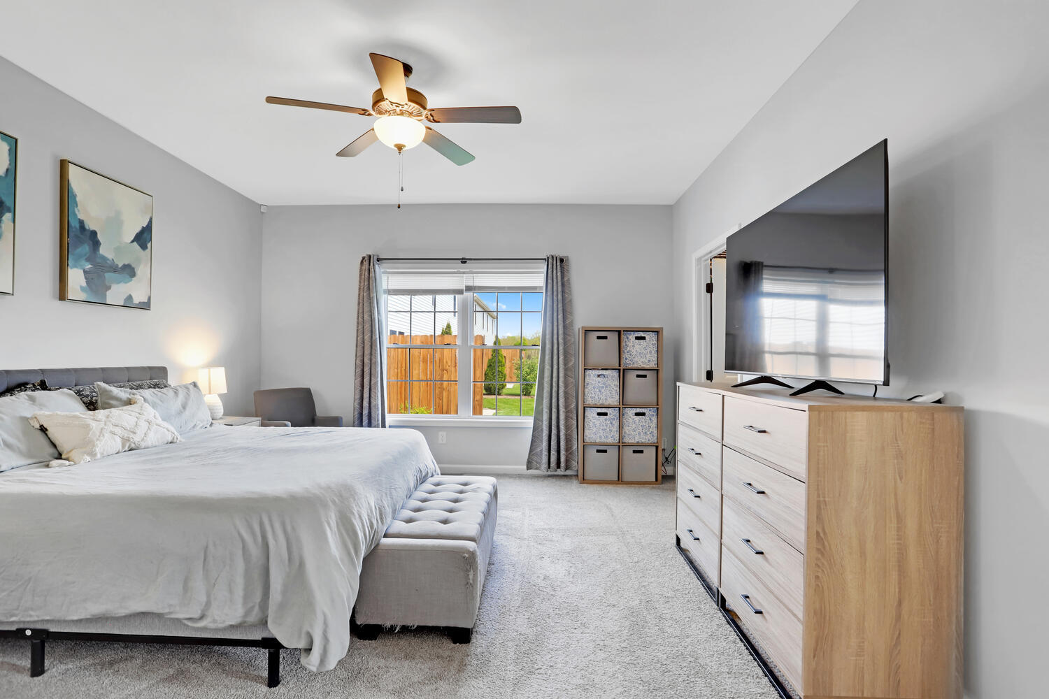 3323 Boulder Ridge Drive Champaign, IL 61822 - Photo 14 of 27 a bedroom with a bed dresser and a window