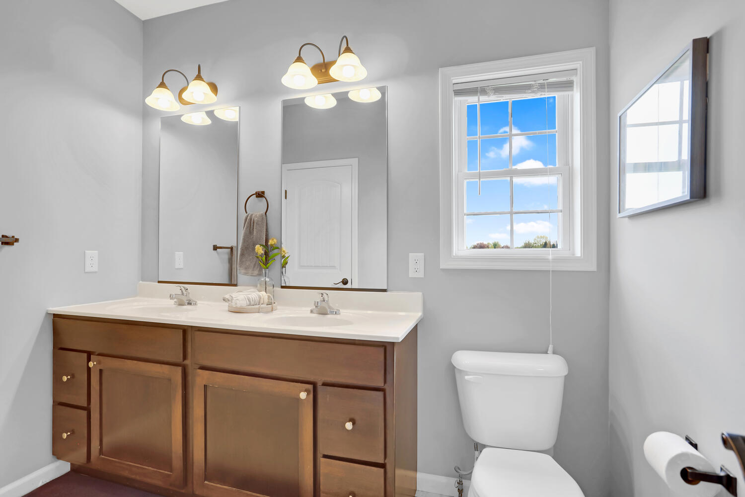 3323 Boulder Ridge Drive Champaign, IL 61822 - Photo 18 of 27 a bathroom with a toilet sink and mirror