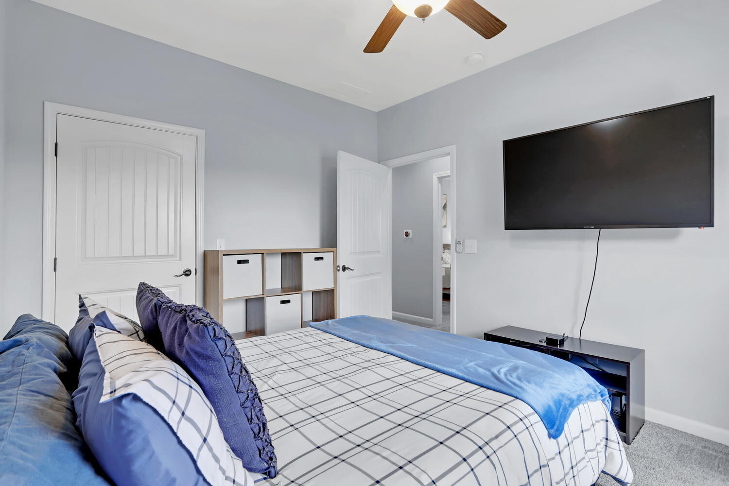 3323 Boulder Ridge Drive Champaign, IL 61822 - Photo 21 of 27 a bedroom with a bed and a flat screen tv