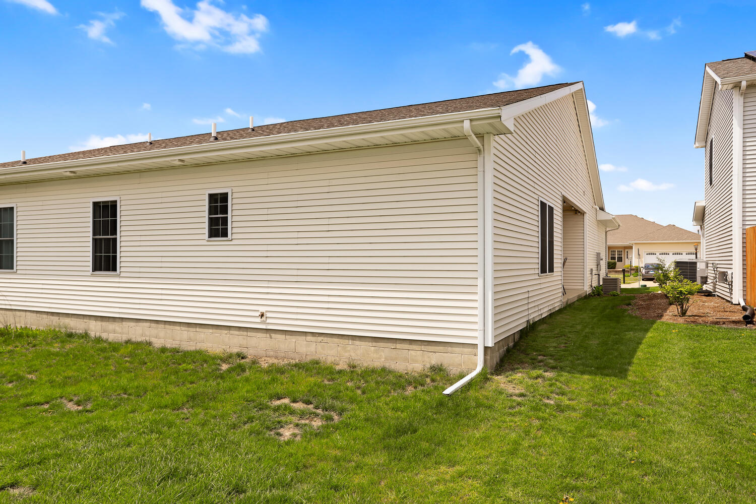 3323 Boulder Ridge Drive Champaign, IL 61822 - Photo 25 of 27 a view of a house with a backyard