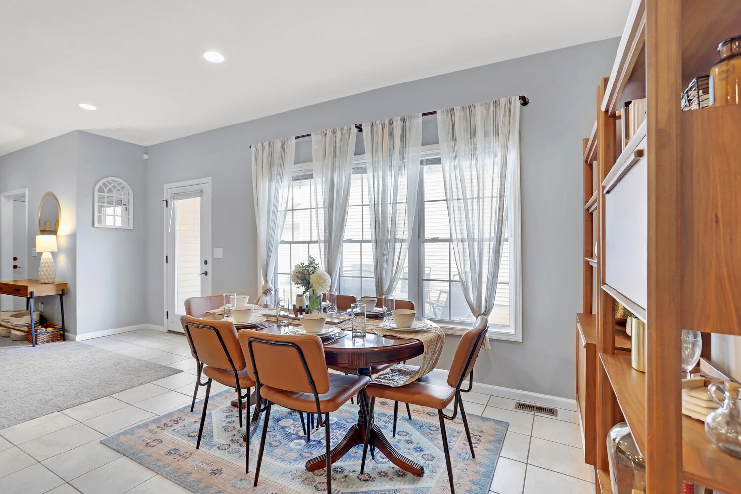 3323 Boulder Ridge Drive Champaign, IL 61822 - Photo 8 of 27 a view of a dining room with furniture and a window
