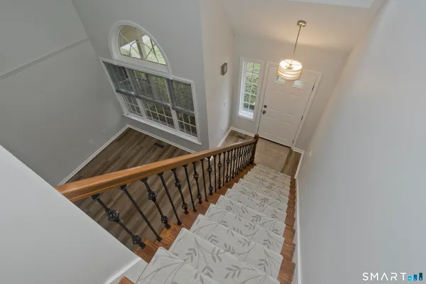 a view of entryway with wooden floor