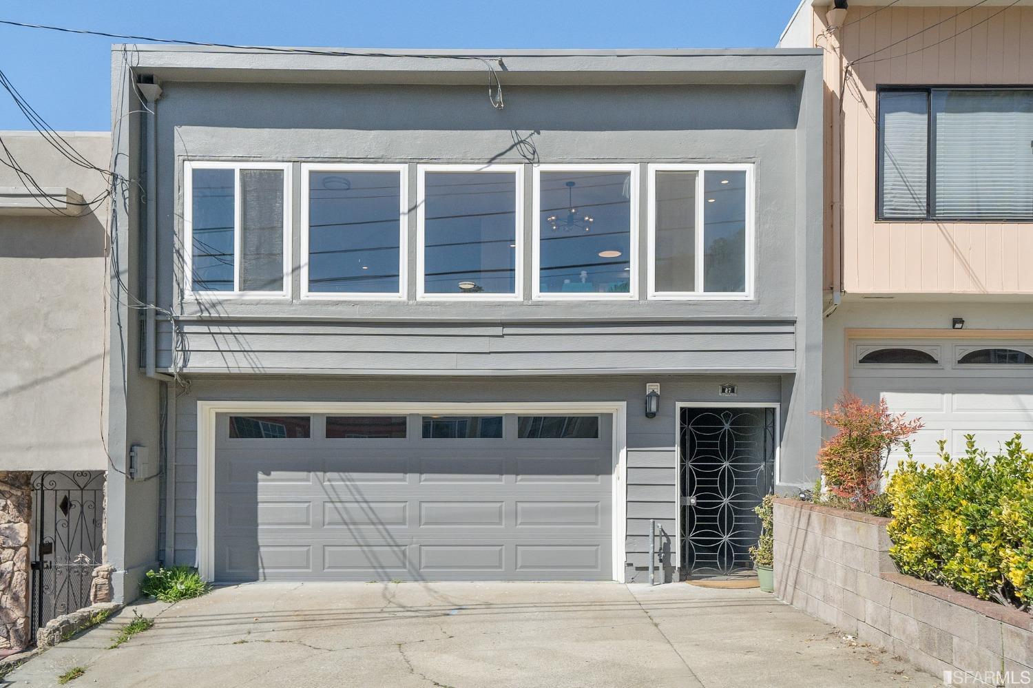 a front view of a house with a garage