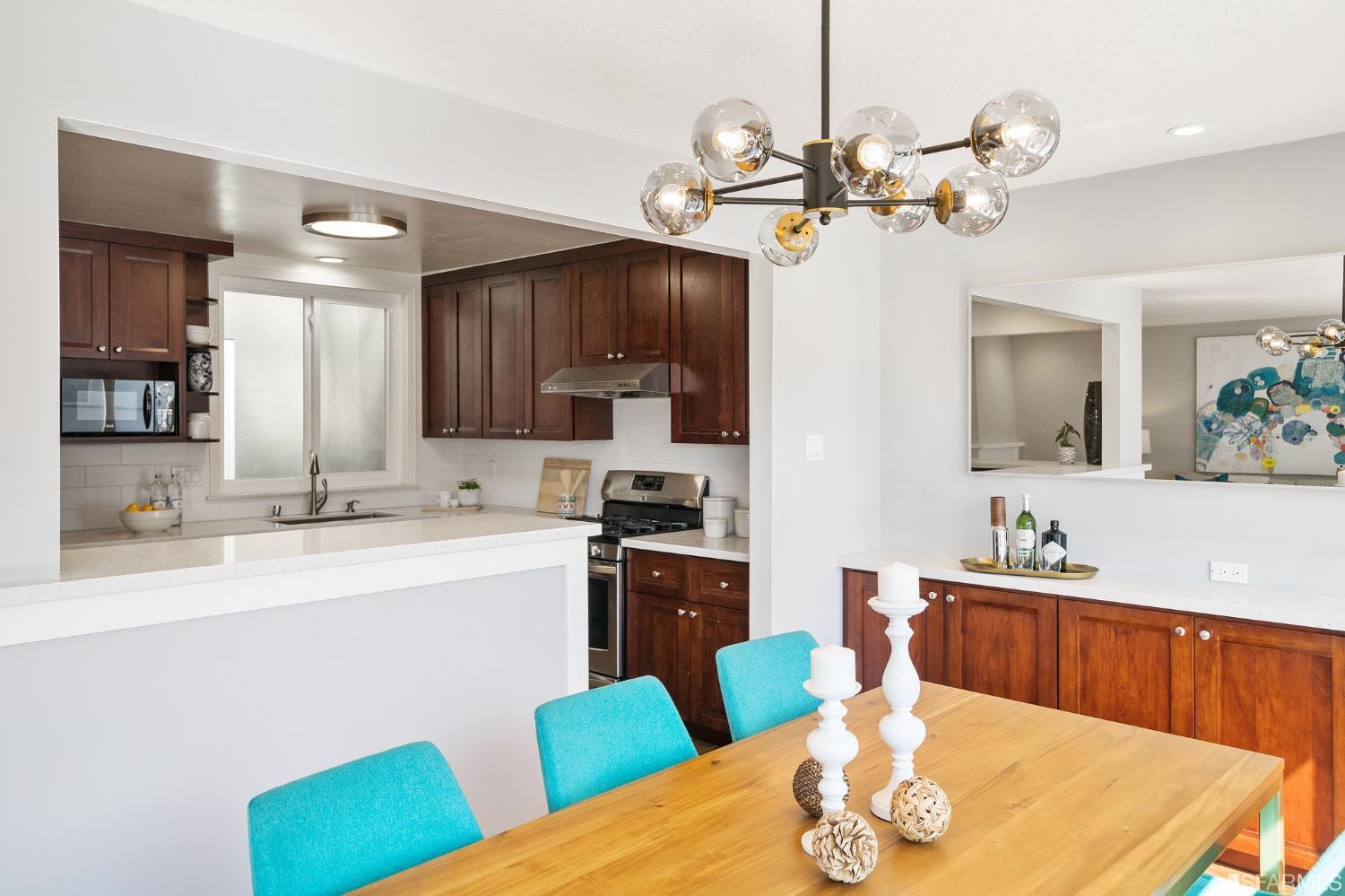 67 Marshall Way Daly City, CA 94014 - Photo 15 of 42 a kitchen with a dining table chairs sink and stove