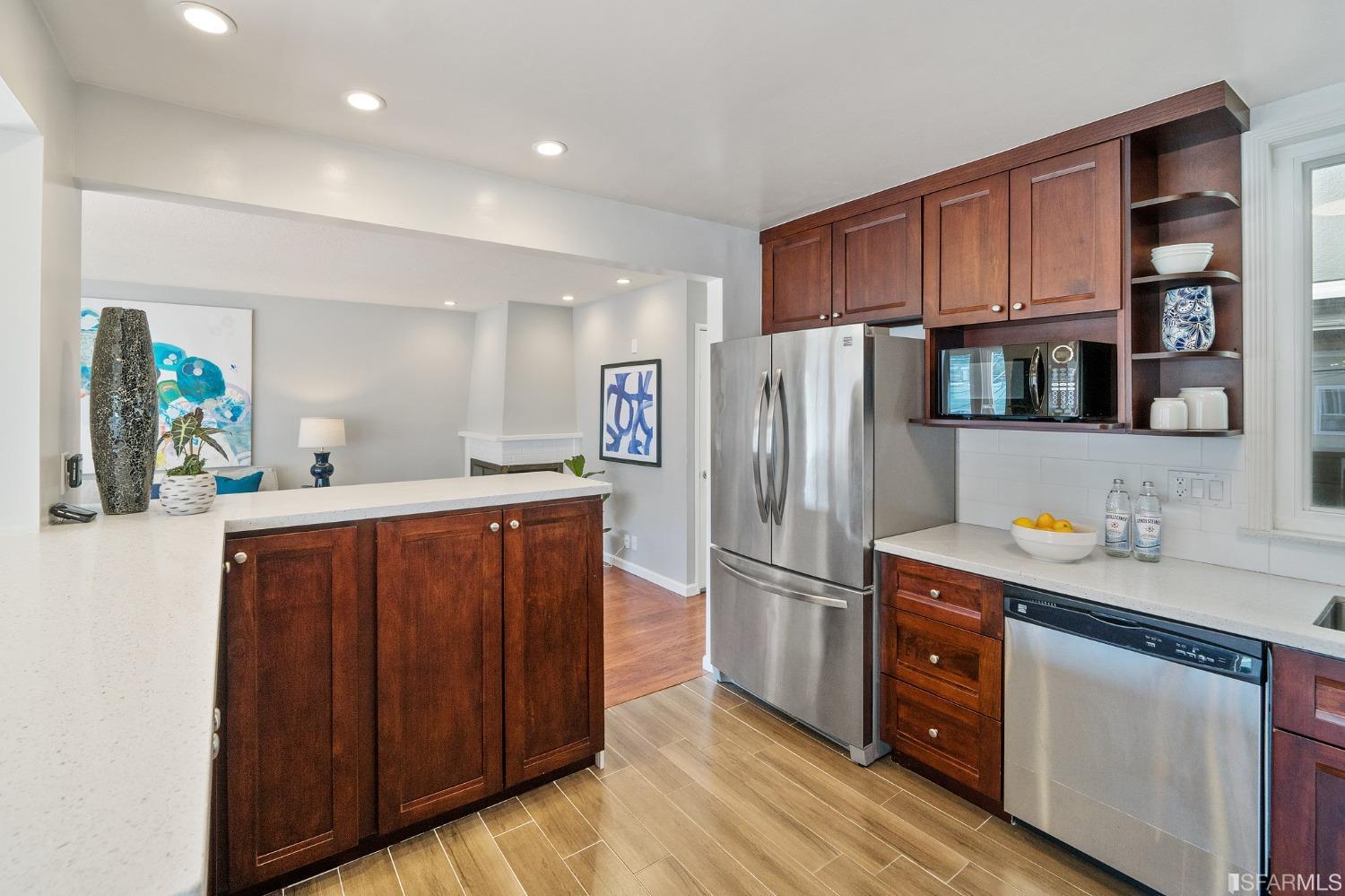 67 Marshall Way Daly City, CA 94014 - Photo 18 of 42 a kitchen with stainless steel appliances granite countertop a refrigerator and a sink