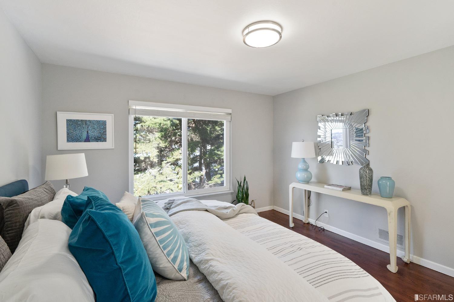 67 Marshall Way Daly City, CA 94014 - Photo 24 of 42 a bedroom with a large bed and a window