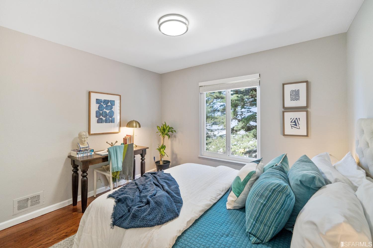 67 Marshall Way Daly City, CA 94014 - Photo 32 of 42 a bed sitting in a bedroom next to a window