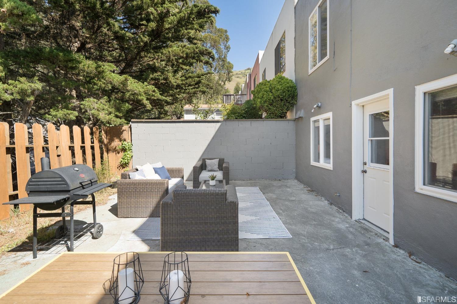 67 Marshall Way Daly City, CA 94014 - Photo 39 of 42 a view of a patio with table and chairs and potted plants