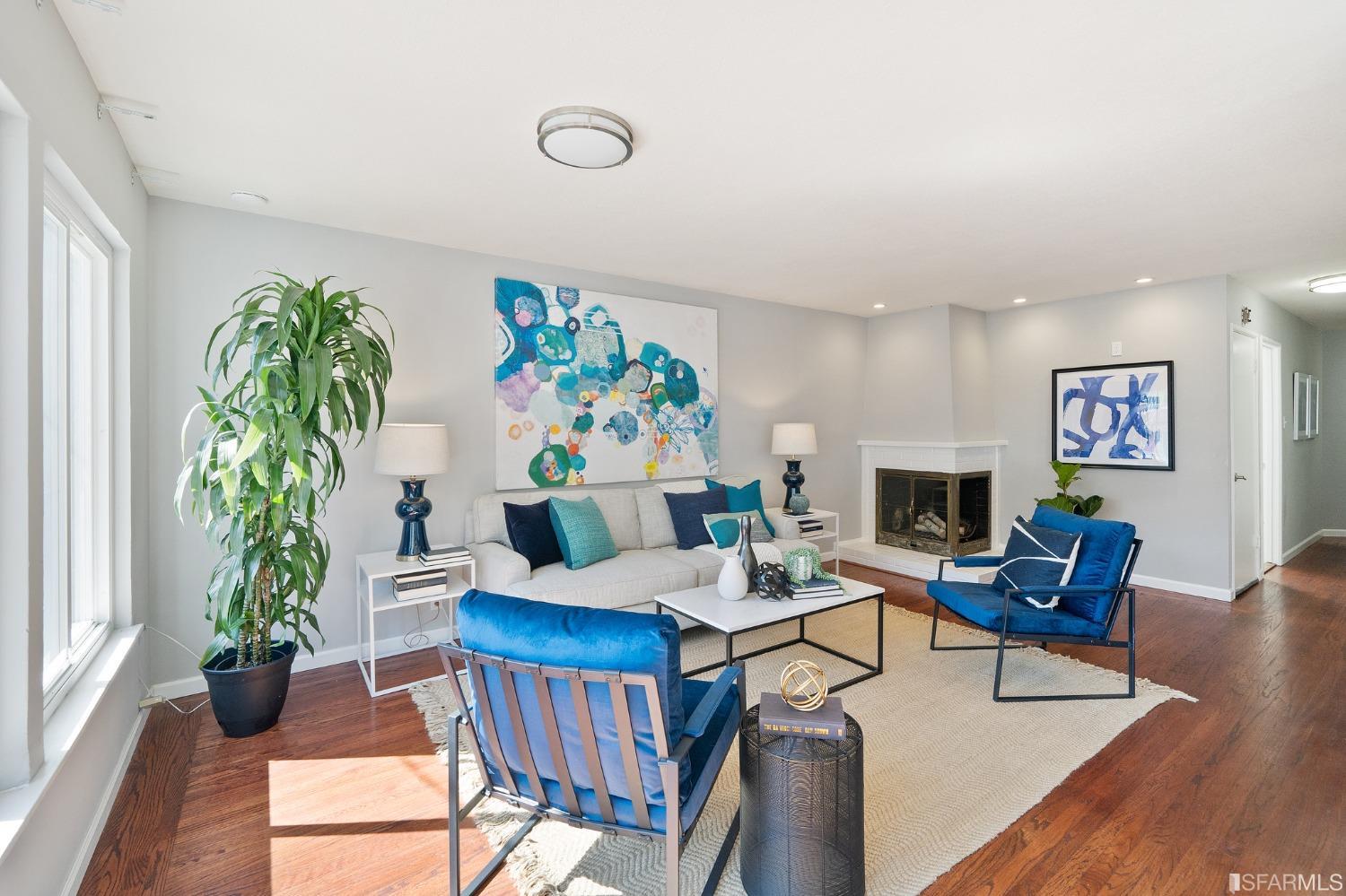 67 Marshall Way Daly City, CA 94014 - Photo 8 of 42 a living room with furniture a fireplace and a potted plant