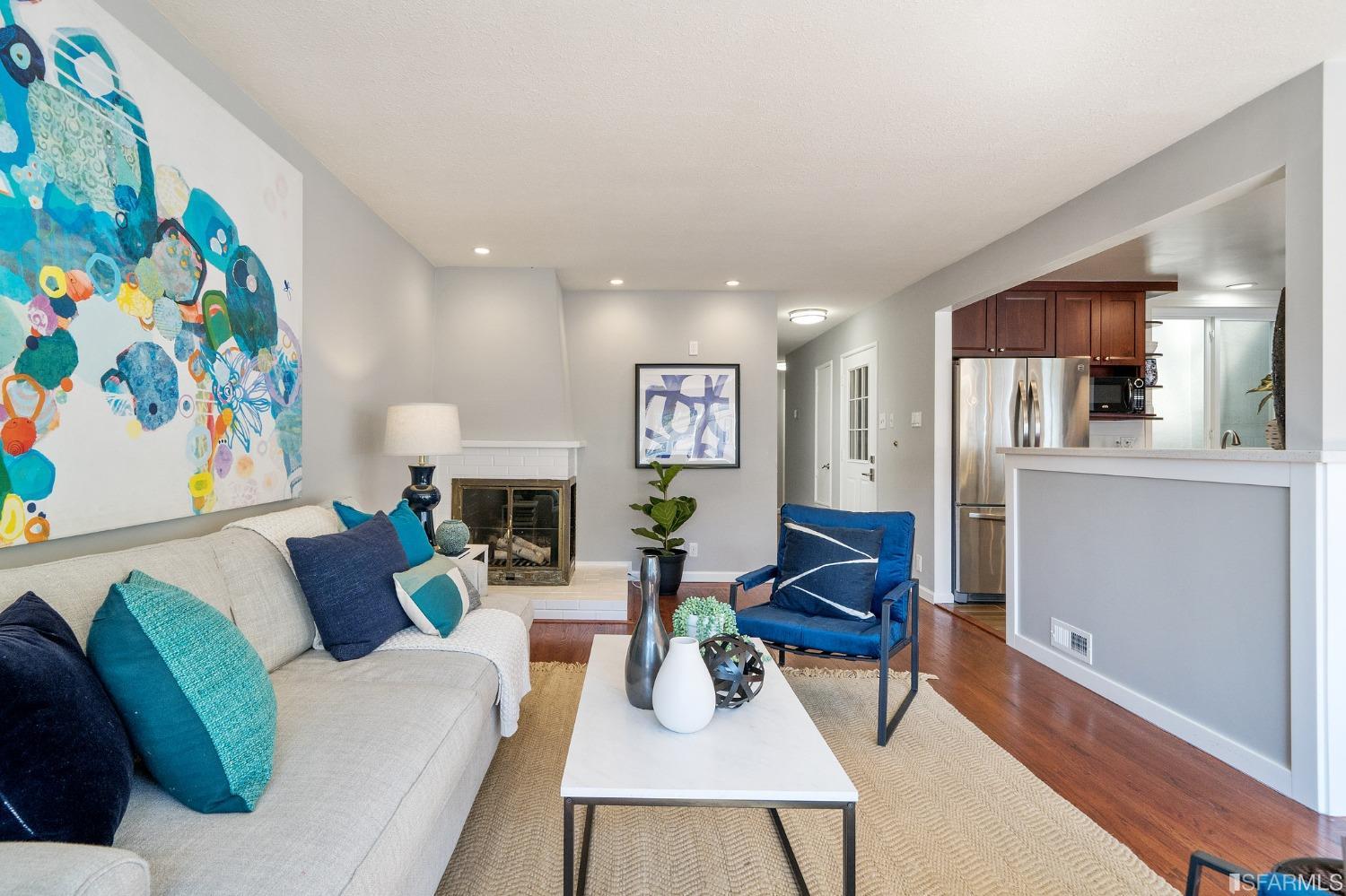67 Marshall Way Daly City, CA 94014 - Photo 10 of 42 a living room with furniture and a fireplace