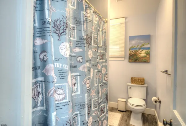 a bathroom with a sink a vanity and a window