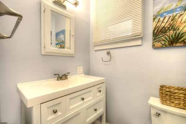 a bathroom with a toilet and a sink