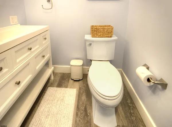 a bathroom with a sink a mirror and a window