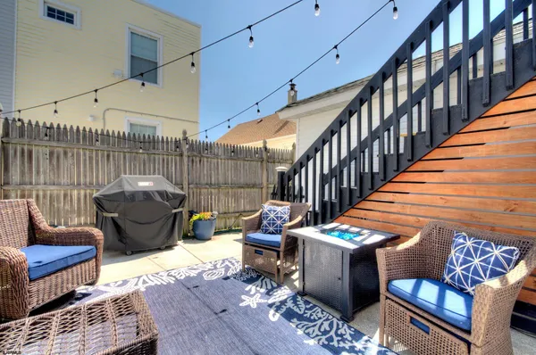 a view of a house with swimming pool and sitting area