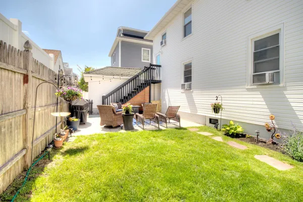 a front view of a house with seating space