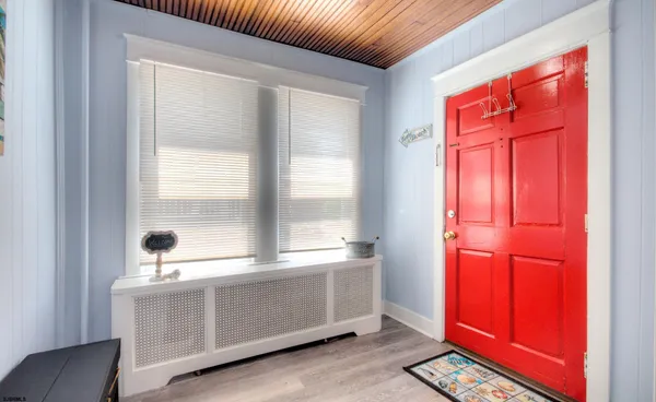 a view of a livingroom with an empty space and a window