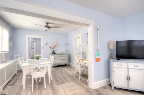 a kitchen with stainless steel appliances a sink a stove a refrigerator and cabinets