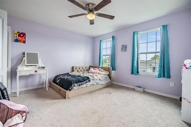 a bed room with a bed and a window