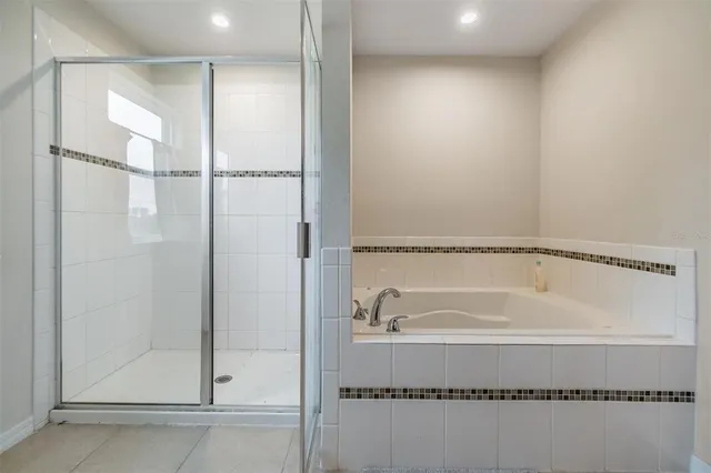 a bathroom with a tub and a shower
