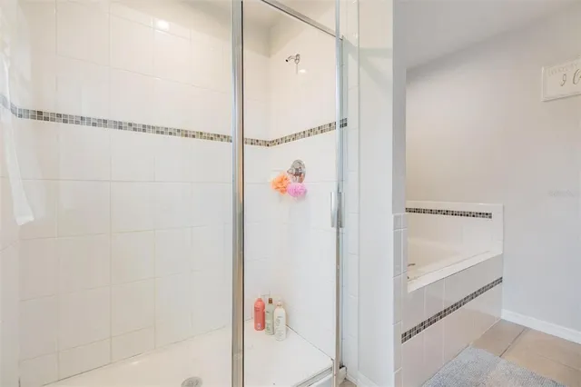 a bathroom with a shower and a shower