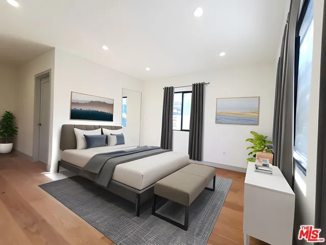 a bathroom with a sink toilet and a mirror