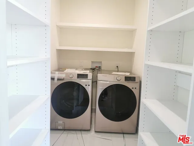 a bathroom with a toilet a sink and a mirror