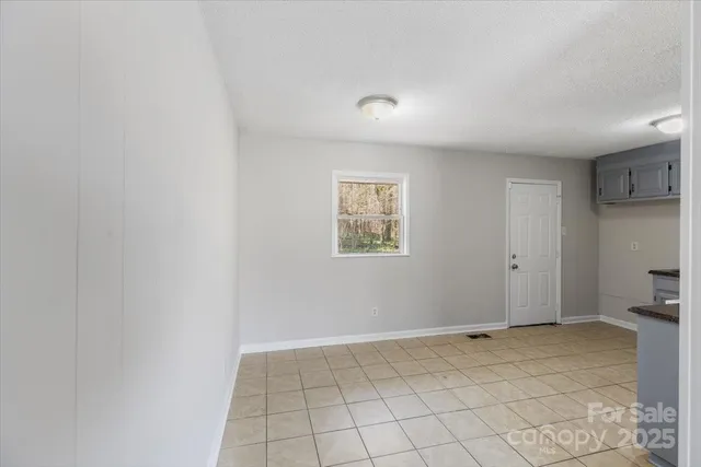 a kitchen with a stove a sink and a refrigerator