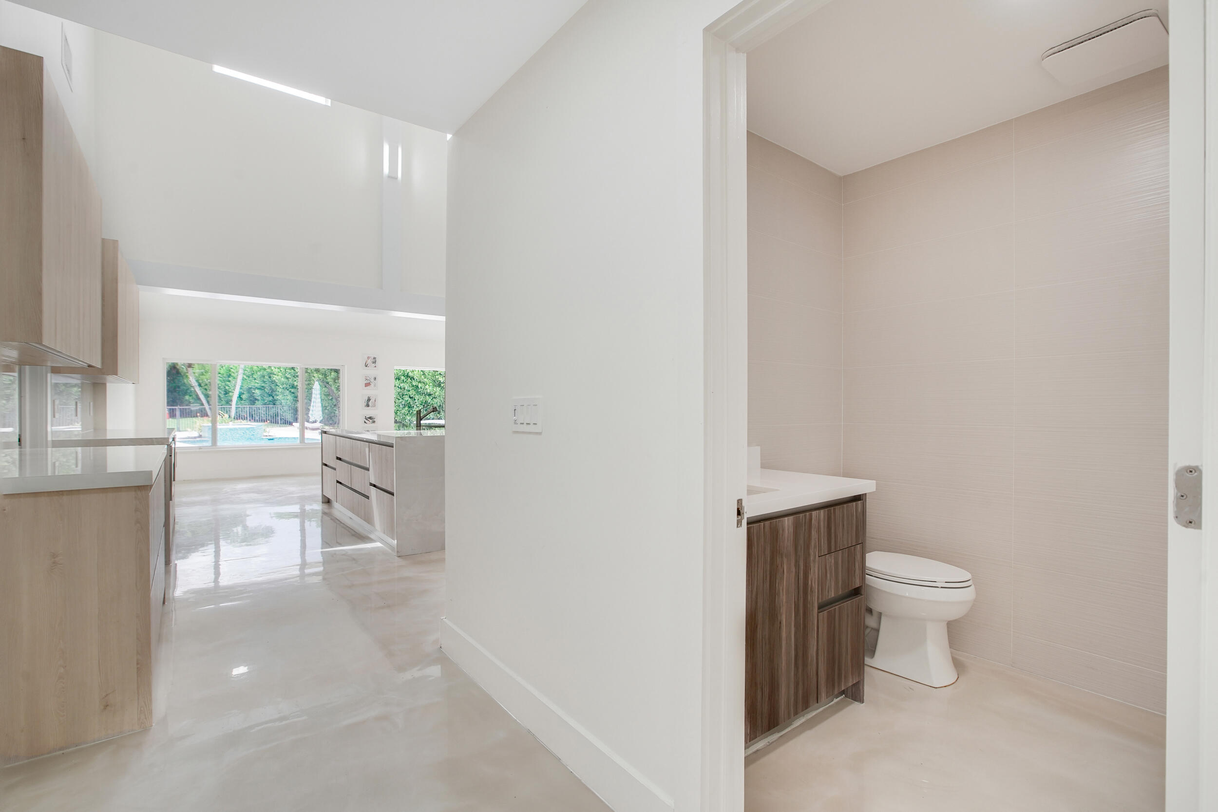 7351 Valencia Drive Boca Raton, FL 33433 - Photo 14 of 39 a view of bathroom with a toilet sink and a mirror