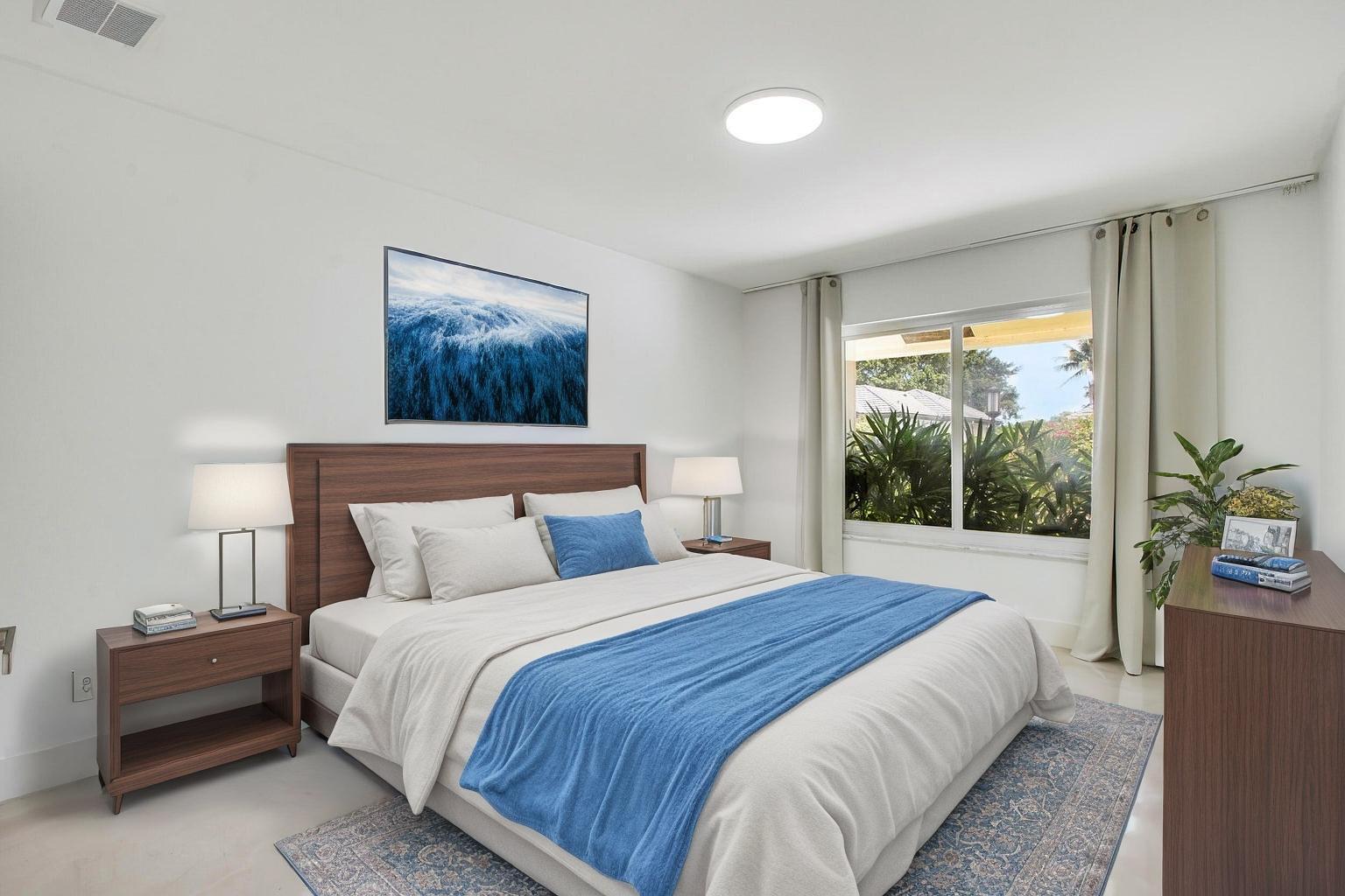 7351 Valencia Drive Boca Raton, FL 33433 - Photo 21 of 39 a bedroom with a bed and a painting on the wall