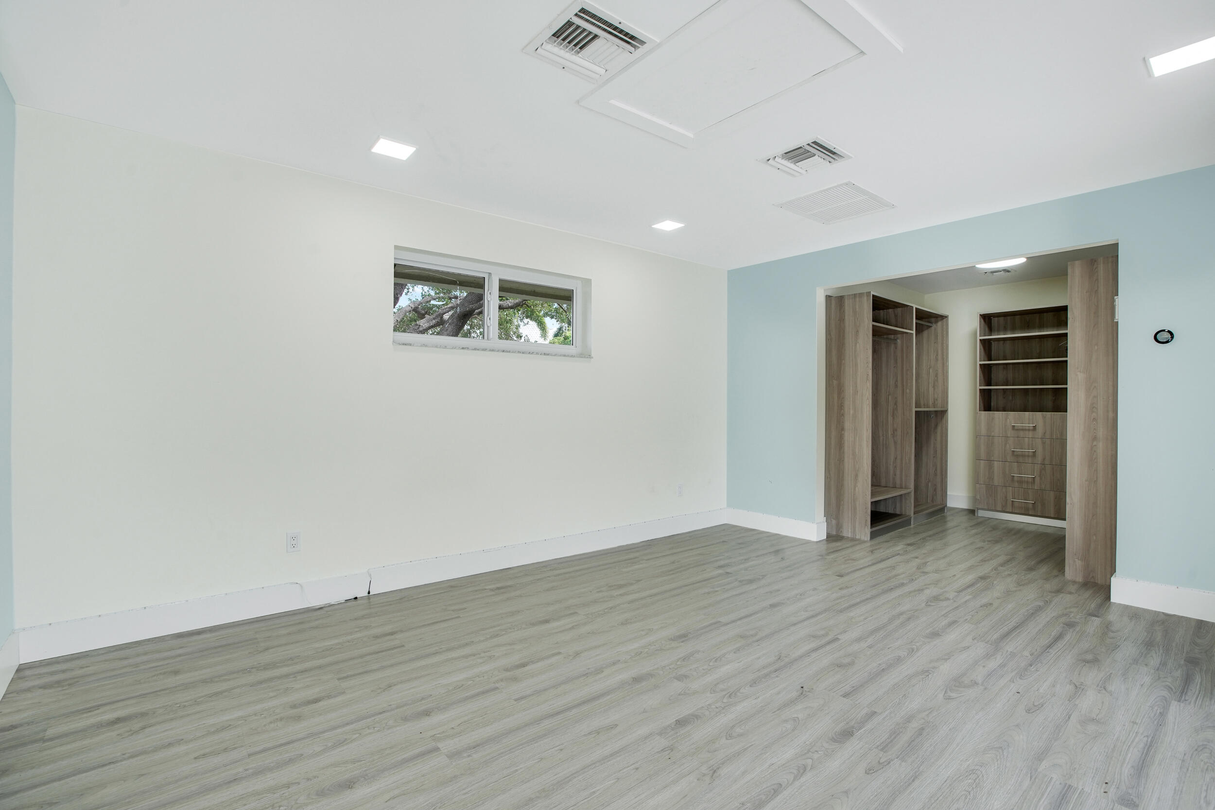 7351 Valencia Drive Boca Raton, FL 33433 - Photo 23 of 39 an empty room with wooden floor and closet