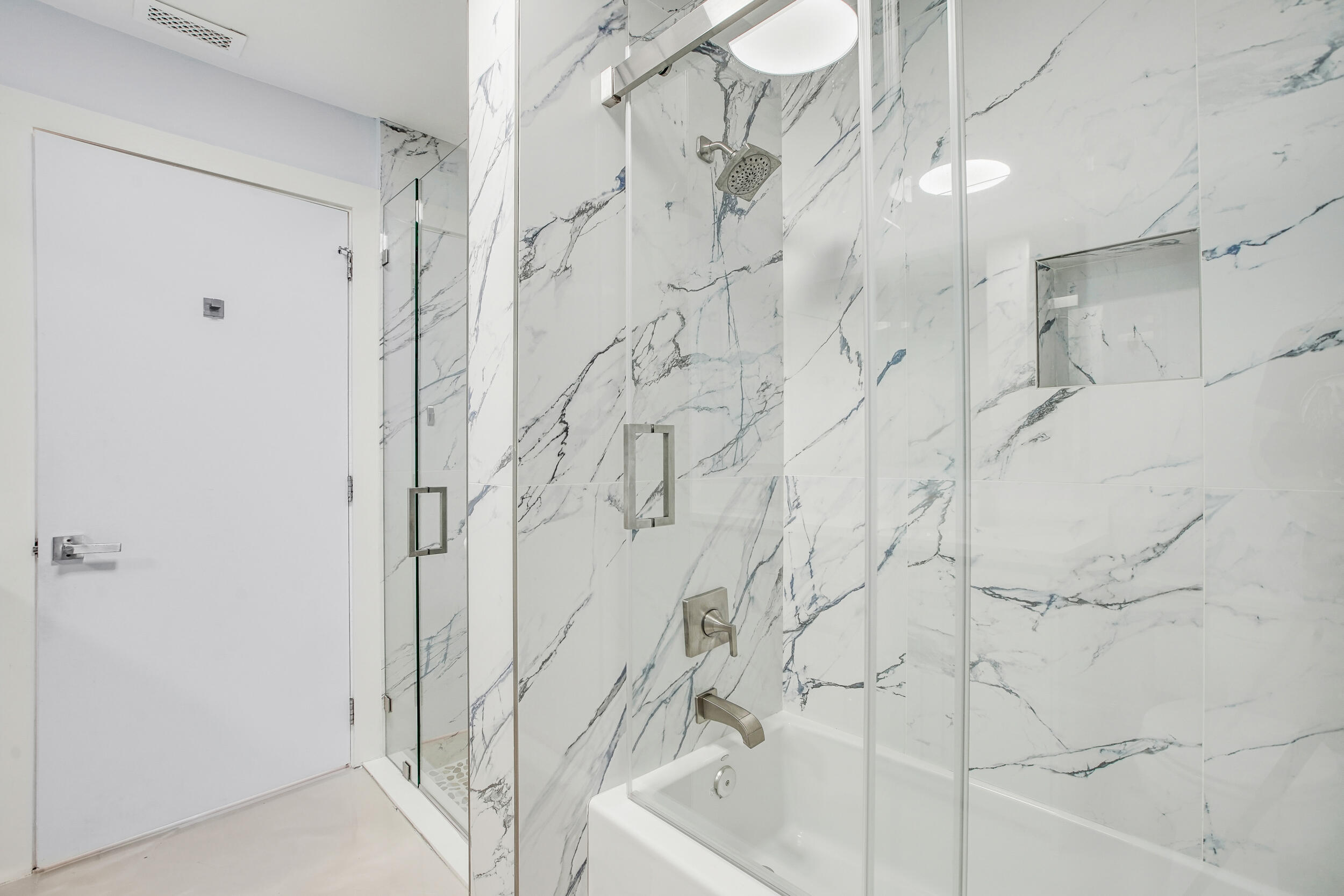 7351 Valencia Drive Boca Raton, FL 33433 - Photo 25 of 39 a bathroom with a bathtub and shower