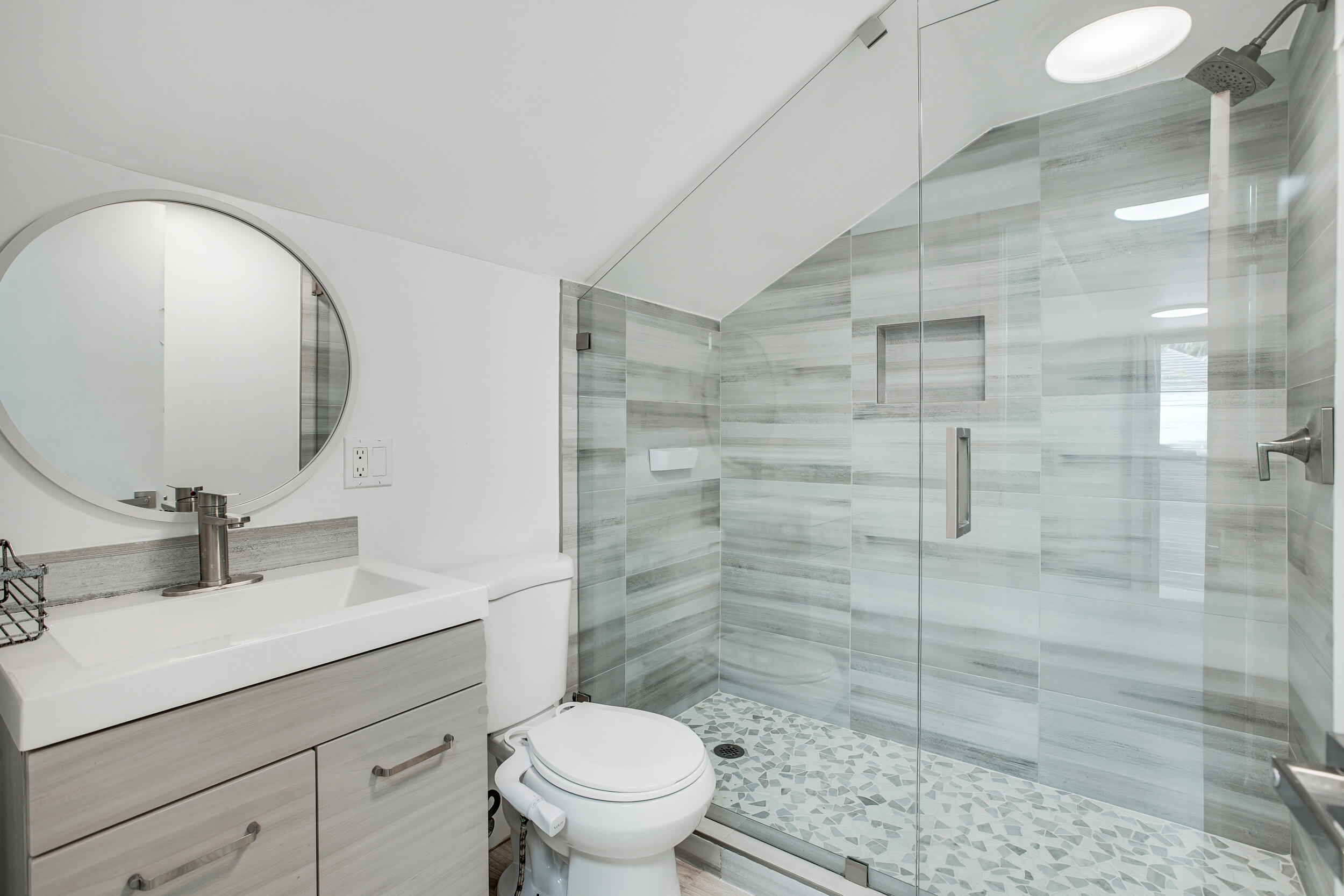 7351 Valencia Drive Boca Raton, FL 33433 - Photo 29 of 39 a bathroom with a sink a toilet and shower