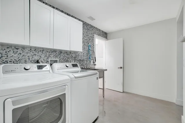 a utility room with dryer and washer