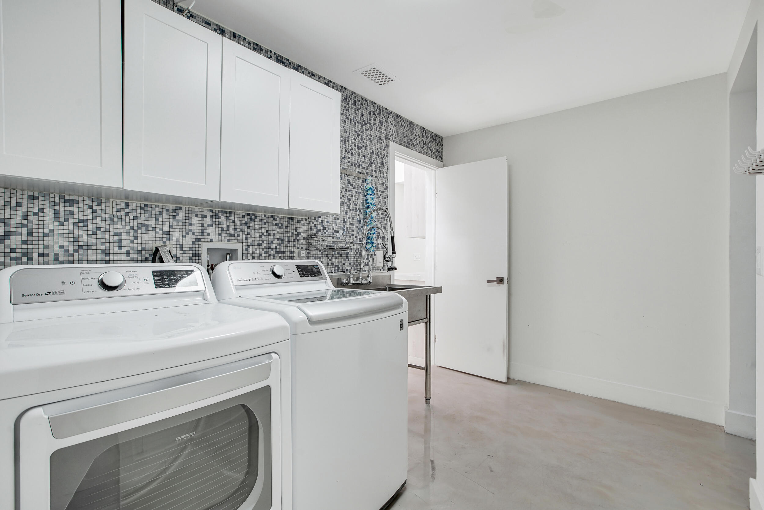 7351 Valencia Drive Boca Raton, FL 33433 - Photo 30 of 39 a utility room with dryer and washer