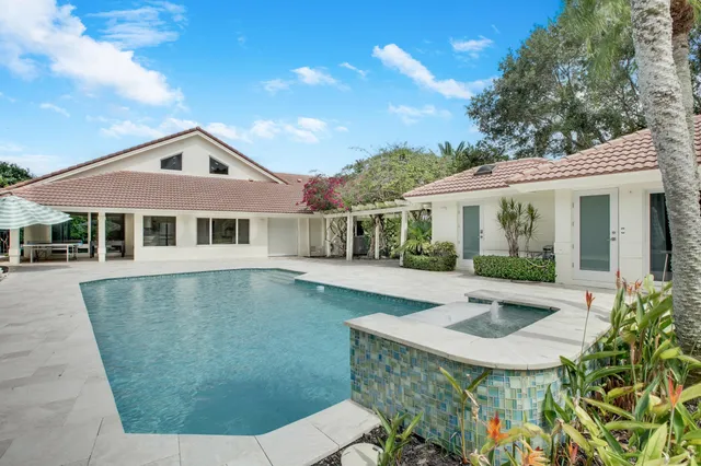 a front view of a house with swimming pool