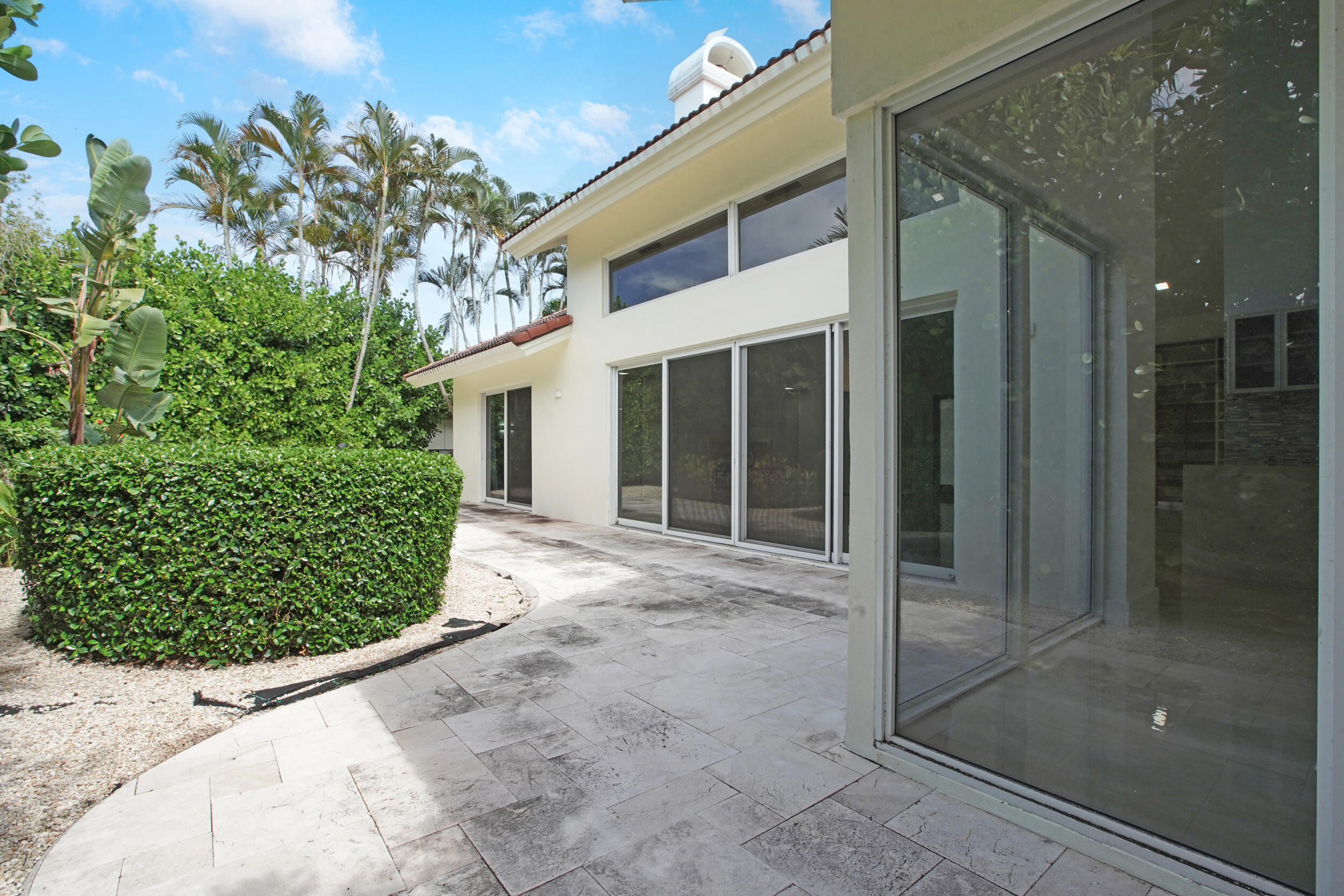 7351 Valencia Drive Boca Raton, FL 33433 - Photo 33 of 39 a view of a glass door with a tree