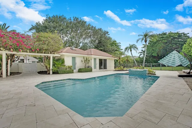 a view of a house with swimming pool