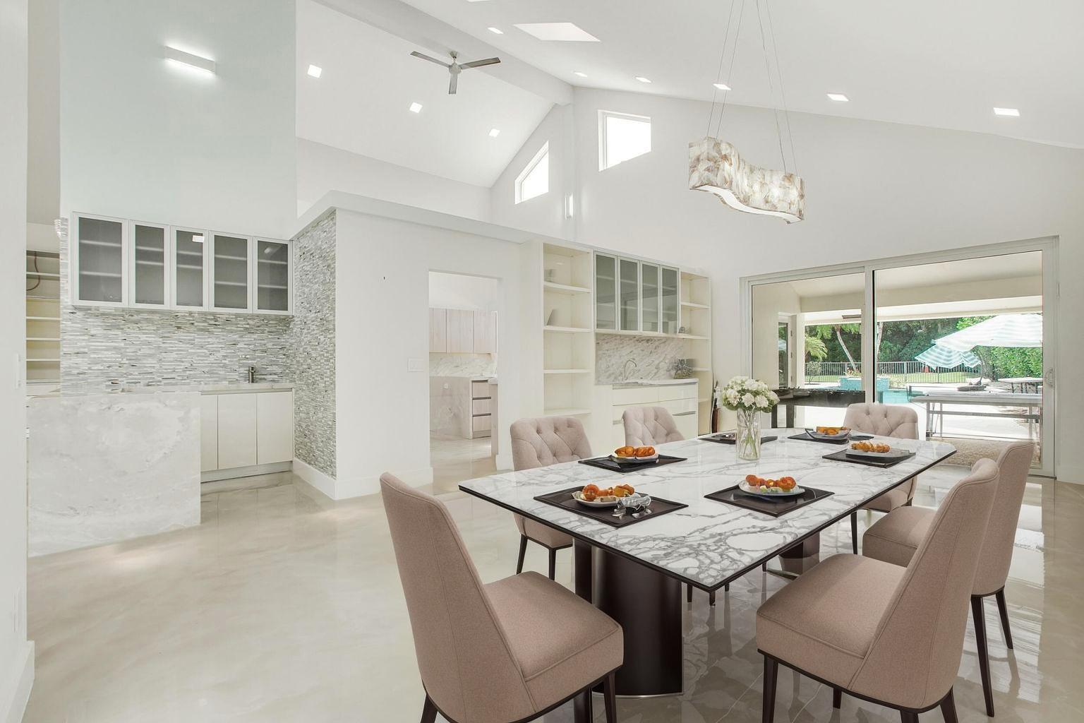 7351 Valencia Drive Boca Raton, FL 33433 - Photo 8 of 39 a view of a dining room and livingroom view with a large window