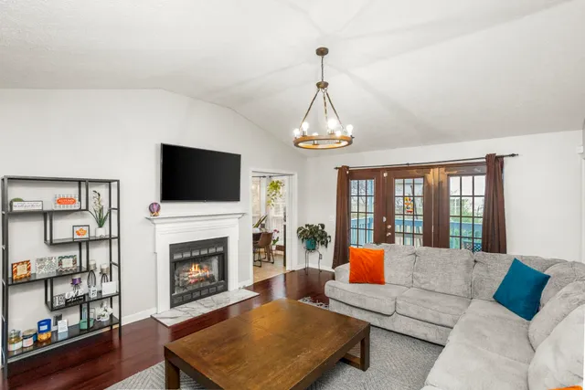 a living room with furniture fireplace and flat screen tv