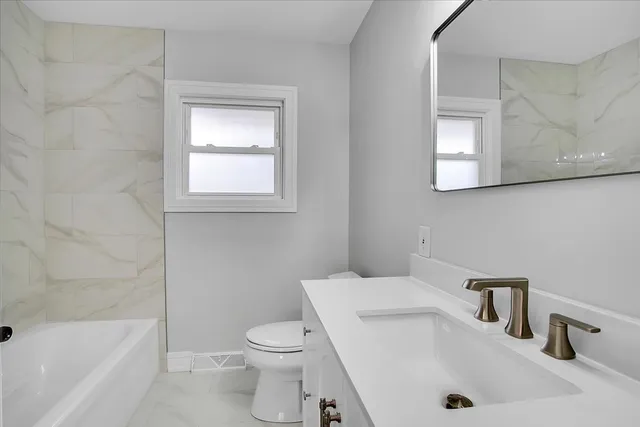 a bathroom with a sink and a tub