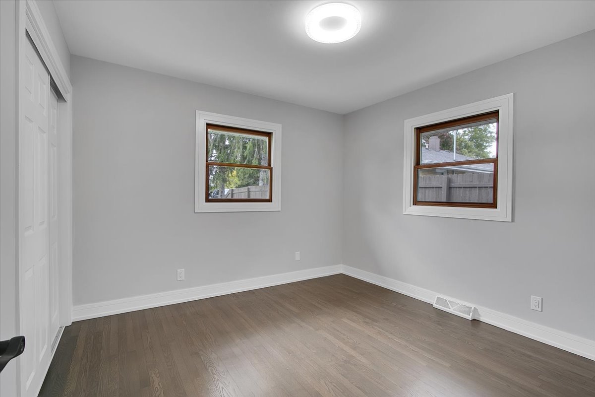 11550 Francis Road Mokena, IL 60448 - Photo 13 of 22 a view of an empty room with wooden floor and window