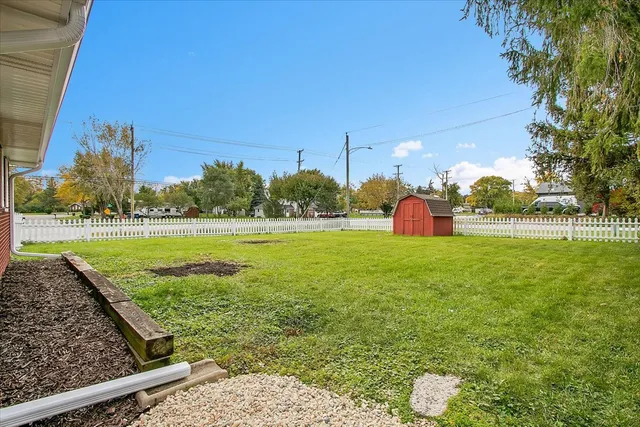 a view of a park with large trees