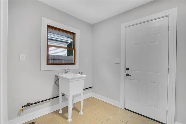 a bathroom with a sink a mirror and a shower