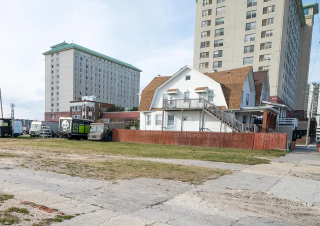 a front view of a building with a yard